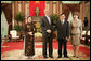 President George W. Bush and Mrs. Laura Bush join Viet President Nguyen Minh Triet and Mrs. Tran Thi Kim Chi in the Great Hall of the Presidential Palace Friday, Nov. 17, 2006, after arriving in Hanoi for the 2006 APEC Summit. White House photo by Eric Draper