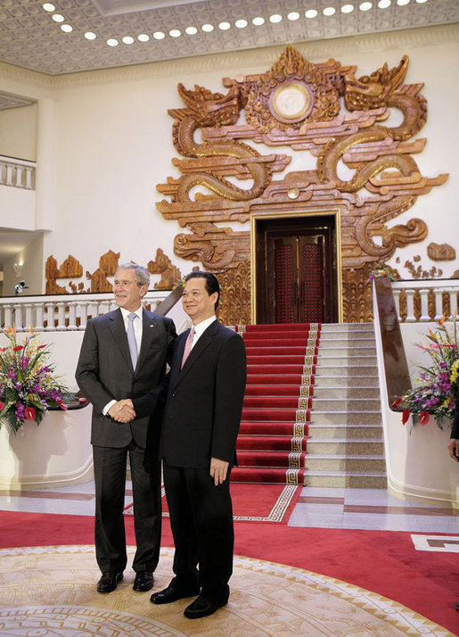 President George W. Bush stands with Prime Minister Nguyen Tan Dung at the Office of the Government Cabinet Room Friday, Nov. 17, 2006, in Hanoi after his arrival with Mrs. Laura Bush to Vietnam. White House photo by Eric Draper