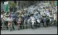 Pedestrians and cyclists line the motorcade route in Hanoi as President George W. Bush and Mrs. Laura Bush head to the Sheraton Hanoi Hotel Friday, Nov. 17, 2006, after their arrival in Vietnam. White House photo by Paul Morse