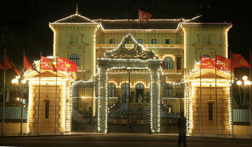 The Presidential Palace in Hanoi is lit up under the night skies Saturday, Nov. 18, 2006. White House photo by Eric Draper