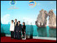 President George W. Bush and Mrs. Laura Bush stand with Viet President Nguyen Minh Triet and Mrs. Tran Thi Kim Chi after arriving Saturday, Nov. 18, 2006, at the National Convention Center in Hanoi for the APEC gala dinner and cultural performance. White House photo by Eric Draper