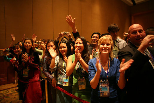 Staff and family members of the U.S. Embassy in Hanoi give an enthusiastic greeting to President George W. Bush as he arrives Saturday, Nov. 18, 2006, at the Sheraton Hanoi after meeting with Southeast Asian leaders. White House photo by Paul Morse