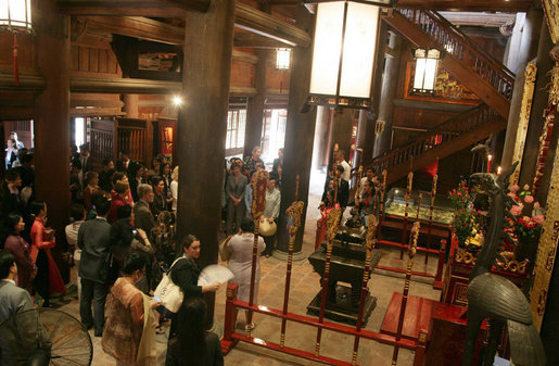 Spouses of the APEC leaders, including Mrs. Laura Bush, center, join in a tour of the Temple of Literature in Hanoi Saturday, Nov. 18, 2006. White House photo by Shealah Craighead