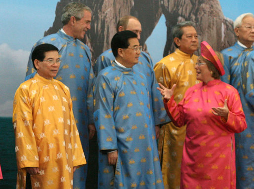 President George W. Bush shares a light moment with Chile's President Michelle Bachalet as APEC leaders posed for an official portrait Sunday, Nov. 19, 2006, before adjourning the 2006 APEC Summit in Hanoi. White House photo by Eric Draper