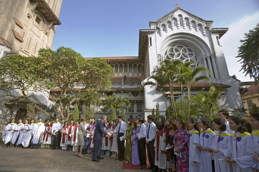 President George W. Bush and Laura Bush greet members of Cua Bac Church in Hanoi, Vietnam, Sunday, Nov. 19, 2006. The President and Mrs. Bush attended service and addressed the press afterwards. White House photo by Shealah Craighead