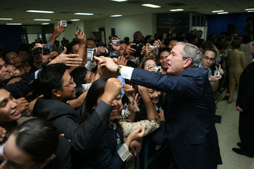 President George W. Bush greets U.S. Embassy staff and families upon his arrival to Jakarta, Indonesia, Nov. 20, 2006. White House photo by Paul Morse