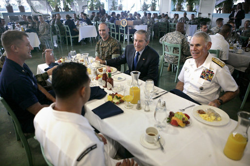 President George W. Bush joins Admiral William J. Fallon, right, Commander of the U.S. Pacific Command, and other military personnel during a breakfast Tuesday, Nov. 21, 2006, at the Officers Club at Hickam Air Force Base in Honolulu, Hawaii. White House photo by Eric Draper