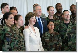 President George W. Bush and Laura Bush pose for photos with military personnel during a breakfast Tuesday, Nov. 21, 2006, at the Officers Club at Hickam Air Force Base in Honolulu, Hawaii. White House photo by Eric Draper