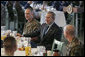 President George W. Bush visits with military personnel during a breakfast Tuesday, Nov. 21, 2006, at the Officers Club at Hickam Air Force Base in Honolulu, Hawaii. White House photo by Paul Morse