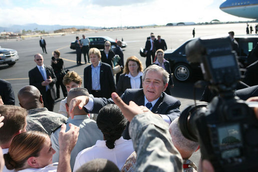 President George W. Bush and Laura Bush shake hands with military personnel as they prepare to depart Honolulu, Hawaii, Tuesday, Nov. 21, 2006, for their flight home to Washington, D.C., following their eight-day trip to Asia. White House photo by Paul Morse