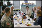 Mrs. Laura Bush is joined by Mary Fallon, left, wife of Navy Admiral William J. Fallon the Commander of the U.S. Pacific Command, during breakfast with military personnel Tuesday, Nov. 21, 2006, at the Officers Club at Hickam Air Force Base in Honolulu, Hawaii. White House photo by Shealah Craighead