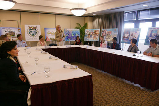 Mrs. Laura Bush is introduced by Mary Fallon, right, wife of Navy Admiral William J. Fallon the Commander of the U.S. Pacific Command, during a roundtable discussion with military personnel Tuesday, Nov. 21, 2006, on military housing and educational services provided to families stationed in Honolulu, Hawaii. White House photo by Shealah Craighead