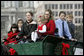 Some of the younger members of the Botek family bring in the official White House Christmas tree to Mrs. Laura Bush on the North Portico Monday, Nov. 27, 2006. The Botek family owns Crystal Springs Tree Farm and donated the 18-foot Douglas fir tree. White House photo by Kimberlee Hewitt