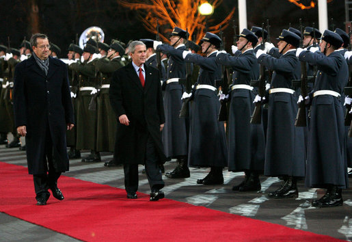 President George W. Bush and President Toomas Hendrik Ilves of Estonia review the troops during the arrival ceremony Tuesday, Nov. 28, 2006, in Tallinn at Kadriorg Palace. White House photo by Eric Draper