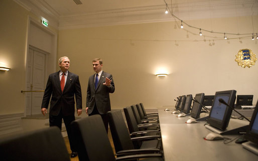 President George W. Bush walks with Estonia's Prime Minister Andrus Ansip Tuesday, Nov. 28, 2006, during his visit to the Stenbock House in Tallinn. White House photo by Eric Draper