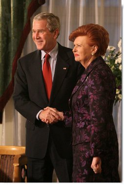 President George W. Bush and Latvia's President Vaira Vike-Freiberga exchange handshakes Tuesday, Nov. 28, 2006, during their meeting at Riga Castle in Riga, Latvia. White House photo by Eric Draper