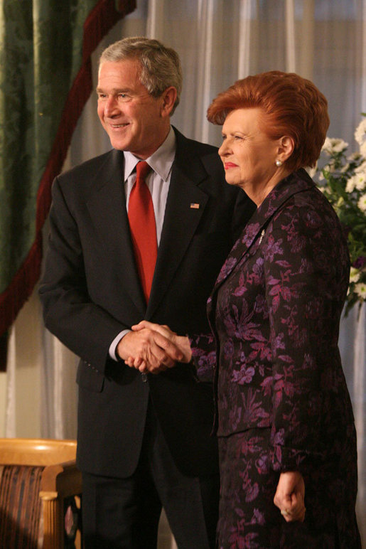 President George W. Bush and Latvia's President Vaira Vike-Freiberga exchange handshakes Tuesday, Nov. 28, 2006, during their meeting at Riga Castle in Riga, Latvia. White House photo by Eric Draper