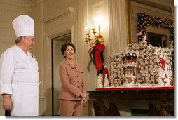 Mrs. Laura Bush and former chef Roland Mesnier discuss the gingerbread White House with the press in the State Dining Room Thursday, Nov. 30, 2006. The house consists of more than 300 pounds of dark chocolate and gingerbread. White House photo by Shealah Craighead