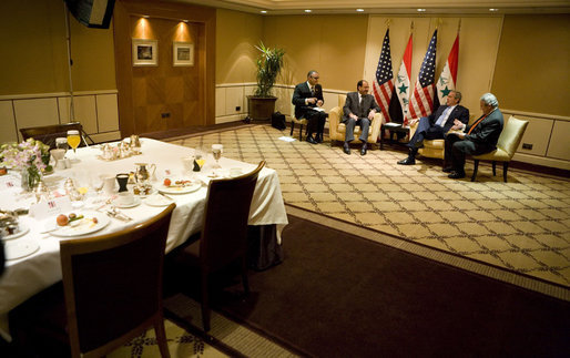 President George W. Bush meets with Prime Minister Nouri al-Maliki of Iraq Thursday, Nov. 30, 2006, at the Four Seasons Hotel in Amman. Afterward, the two leaders issued a joint statement that thanked Jordan's King Abdullah II for hosting the Amman meetings and said they were pleased to "continue our consultations on building security and stability in Iraq." White House photo by Eric Draper