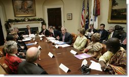 President George W. Bush and Laura Bush host a meeting on World AIDS Day in the Roosevelt Room at the White House, Friday, Dec. 1, 2006. As this World AIDS Day marks the 25th anniversary of the discovery of the HIV virus, President Bush said, “It is a day for the world to recognize the fact that there are 39 million people living with HIV/AIDS, and a day to remember the fact that 25 million people have died of AIDS.”  White House photo by Eric Draper