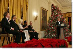 President George W. Bush speaks during a reception for the Kennedy Center honorees in the East Room Sunday, Dec. 3, 2006. They are, from left: musical theater composer Andrew Lloyd Webber; conductor Zubin Mehta; country singer Dolly Parton; singer and songwriter William "Smokey" Robinson; and film director Steven Spielberg.  White House photo by Shealah Craighead