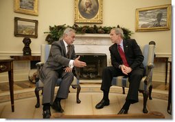 President George W. Bush meets with Vice President Tariq al-Hashemi of Iraq in the Oval Office Tuesday, Dec. 12, 2006. The two men spent their time together talking about the conditions in Iraq and what the United States can do to help the country's government succeed.  White House photo by Eric Draper