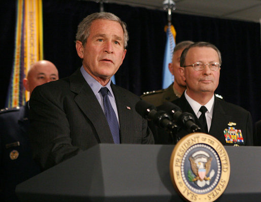 President George W. Bush answers questions from reporters following his meeting on Iraq with U.S. military leaders at the Pentagon, Wednesday, Dec. 13, 2006. Admiral Edmund P. Giambastiani is seen at right. White House photo by Eric Draper