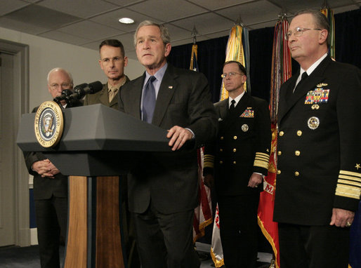 President George W. Bush listens to a reporter’s question following his meeting on Iraq with U.S. military leaders at the Pentagon, Wednesday, Dec. 13, 2006, joined by from left, Vice President Dick Cheney; Chairman of the Joint Chiefs of Staff, General Peter Pace and Vice Chairman of the Joint Chiefs of Staff Admiral Edmund P. Giambastiani, right. White House photo by Eric Draper