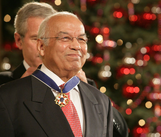 Dr. Norman C. Francis is honored by President George W. Bush with the Presidential Medal of Freedom Friday, Dec. 15, 2006, in the East Room of the White House. President Bush told the audience, "Dr. Francis is known across Louisiana, and throughout our country, as a man of deep intellect and compassion and character. All of us admire the good life and remarkable career of Dr. Norman C. Francis." White House photo by Shealah Craighead