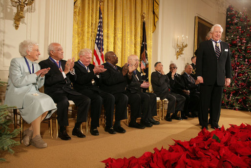 Fellow recipients of the 2006 Presidential Medal of Freedom applaud as President George W. Bush bestows the honor on David McCullough during ceremonies Friday, Dec. 15, 2006, at the White House. Said the President, "This chronicler of other times is one of the eminent Americans of our time. The nation owes a debt of gratitude to a fine author and a fine man." White House photo by Shealah Craighead