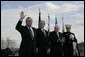 Secretary of Defense Donald Rumsfeld acknowledges a standing ovation in his honor joined by President George W. Bush, Vice President Dick Cheney and General Peter Pace, Chairman of the Joint Chiefs of Statf, following Rumsfeld's farewell address Friday, Dec. 15, 2006, at the Armed Forces Full Honor Review at the Pentagon. The Secretary, who has served since 2001, told the audience that he will remember "all those couragous folks that I have met deployed in the field; those in the military hospitals that we visited; and I will remember the fallen, and I will particularly remember their families from whom I have drawn inspiration." White House photo by Eric Draper