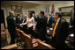 President George W. Bush greets Maya Pick, a student from the University of Virginia, during a meeting with Jewish leaders from the higher education community in the Roosevelt Room Monday, Dec. 18, 2006. White House photo by Eric Draper