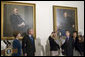 President George W. Bush and Laura Bush watch as Ariel Cohen, 14, lights the Menorah on the fourth night of Hanukkah during the annual White House Hanukkah reception Monday, Dec. 18, 2006. Pictured at right are Ariel's parents, Dan and Rachel Cohen, and sister Alison, 11. White House photo by Shealah Craighead