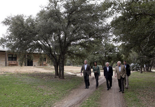 President George W. Bush is joined by Vice President Dick Cheney, Secretary of Defense Robert Gates, Secretary of State Condoleezza Rice and Chairman of the Joint Chiefs of Staff General Peter Pace, right-background, as they walk to meet with reporters following President Bush’s meeting with his national Security team Thursday, Dec. 28, 2006, at Prairie Chapel Ranch in Crawford, Texas. White House photo by Paul Morse