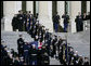 Former first lady Betty Ford stands at the top of the East Steps of the U.S. Capitol as military pallbearers carry the casket of former President Gerald R. Ford up the steps of the U.S. Capitol, Saturday evening, Dec. 30, 2006 in Washington, D.C., to the State Funeral ceremony in the Capitol Rotunda. White House photo by Shealah Craighead