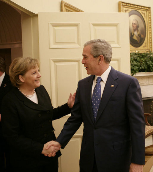 President George W. Bush welcomes German Chancellor Angela Merkel to the Oval Office, Thursday, Jan. 4, 2006, at the White House. White House photo by Eric Draper