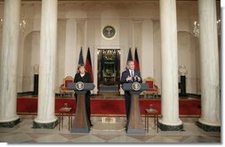 President George W. Bush responds to a reporter’s question during a joint news conference with German Chancellor Angela Merkel at the White House, Thursday, Jan. 4, 2006, answering questions on Iraq, the Middle East and U.S.-European economic issues. White House photo by Paul Morse