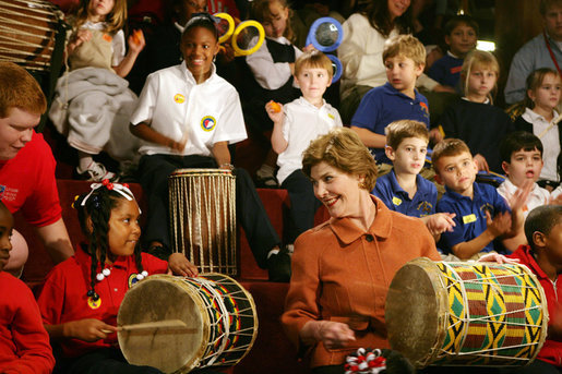 Mrs. Laura Bush joins in a musical number playing a drum with children at the Louisiana Children’s Museum in New Orleans, Tuesday, Jan. 9, 2007, during her visit to see the rebuilding progress in the Gulf Coast region. The museum, closed nearly a year following the 2005 hurricanes, is working to address the needs of young children and families seeking a safe and nurturing environment. White House photo by Shealah Craighead