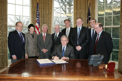 President George W. Bush prepares to sign H.R. 5946, the Magnuson-Stevens Fishery Conservation and Management Reauthorization Act of 2006, Friday, Jan. 12, 2007 in the Oval Office at the White House. President Bush is joined by, from left, Sen. Ted Stevens of Alaska, Sen. Olympia Snow of Maine, Rep. Nick Rahall of West Virginia., Rep. Jim Saxton of New Jersey, Rep. Frank Palloneof New Jersey; Rep. Don Young of Alaska, U.S. Commerce Secretary Carlos Guiterrez and Rep. Wayne Gilchrest of Maryland. White House photo by Paul Morse