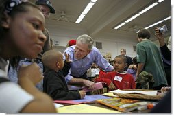 President George W. Bush greets volunteers big and small during Martin Luther King, Jr. Day at Cardozo Senior High School in Washington, D.C., Monday, Jan. 15, 2007. "One of the things that Mrs. King wanted was for MLK Day to be a day of service. It is not a day off, but it's a day on," said the President. "And so I'm here at Cardozo High School to thank the hundreds of people who have showed up to serve the country by volunteering." White House photo by Paul Morse