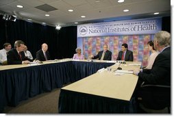 President George W. Bush speaks during a roundtable on cancer prevention at the National Institutes of Health in Bethesda, Md., Wednesday, Jan. 17, 2007. Participants include, from left: Secretary of Health and Human Services Mike Leavitt, NIH Director Dr. John Niederhuber, M.D., Dr. Grace Butler, PhD., NIH Director Dr. Elias Zerhouni, Becky Fisher, and Dr. Francis Collins, M.D., Ph.D.  White House photo by Eric Draper