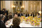 Mrs. Laura Bush attends a luncheon hosted by Madame Bernadette Chirac for the Conference on Missing and Exploited Children at the Elysee Palace in Paris Wednesday, Jan. 17, 2007. President Jacque Chirac of France is pictured in the center. White House photo by Shealah Craighead