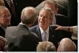 President George W. Bush greets people, shakes hands and signs his autograph after delivering the State of the Union Address in the House Chamber at the U.S. Capitol Tuesday, Jan. 23, 2007. White House photo by Paul Morse