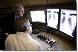 President George W. Bush visits with radiologist Dr. Jeffrey Kunin during a briefing on new x-ray technology at the Saint Luke’s-Lee’s Summit hospital in Lee’s Summit, Mo., Thursday, Jan 25, 2007. President Bush also participated in a roundtable discussion on health care initiatives at the hospital. White House photo by Eric Draper