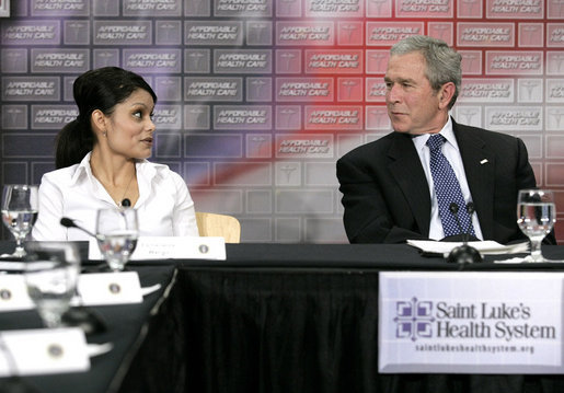 President George W. Bush speaks with Esmerelda Wergin, who works as a waitress in Overland Park, Mo., about how hard it is to maintain insurance for her family during a roundtable discussion on health care initiatives at the Saint Luke’s-Lee’s Summit hospital in Lee’s Summit, Mo., Thursday, Jan 25, 2007. Under the new health care initiatives offered in President Bush’s State of the Union address, Wergin would save over two thousand dollars, making insurance for her family more attainable. White House photo by Eric Draper