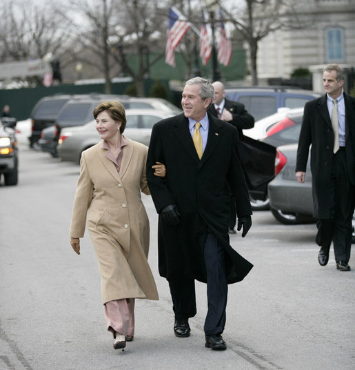 President George W. Bush and Laura Bush walk together as they leave the White House grounds Friday, Jan 26, 2007, to attend the farewell reception at Blair House for White House Counsel Harriet Miers. White House photo by Eric Draper