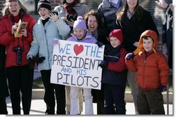 President George W. Bush is greeted by the family members of pilots and crew members of HMX-1, the Marine One Presidential helicopter unit, upon his arrival Friday, Jan. 26, 2007, in Cambridge, Md., to attend the House Republican Conference. White House photo by Paul Morse