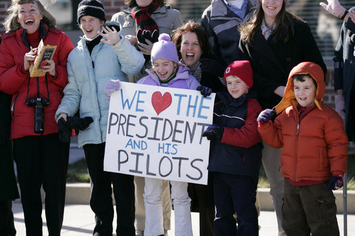 President George W. Bush is greeted by the family members of pilots and crew members of HMX-1, the Marine One Presidential helicopter unit, upon his arrival Friday, Jan. 26, 2007, in Cambridge, Md., to attend the House Republican Conference. White House photo by Paul Morse