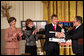 Fred Love, a journalism student at Iowa State University, is presented the Hugh S. Sidey Scholarship in print journalism in the East Room Friday, Jan. 26, 2007. The scholarship is named for Time Magazine correspondent Hugh Sidey. White House photo by Shealah Craighead