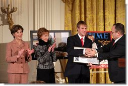 Fred Love, a journalism student at Iowa State University, is presented the Hugh S. Sidey Scholarship in print journalism in the East Room Friday, Jan. 26, 2007. The scholarship is named for Time Magazine correspondent Hugh Sidey. White House photo by Shealah Craighead